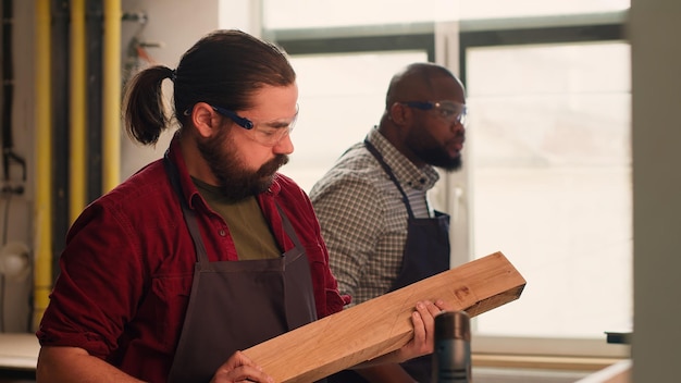 carpenter selecting high quality wood material assembling shop 482257 97990